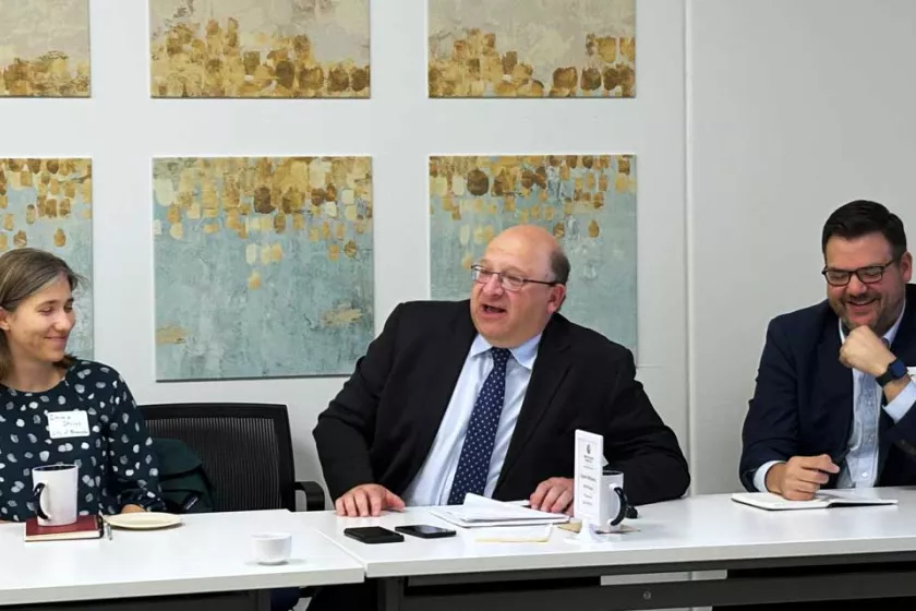 David Eichenthal sits at a table with members of CEN.