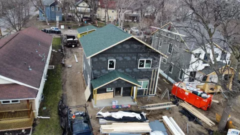 A home under construction in an urban neighborhood.