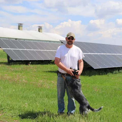 John, his dog and solar panels