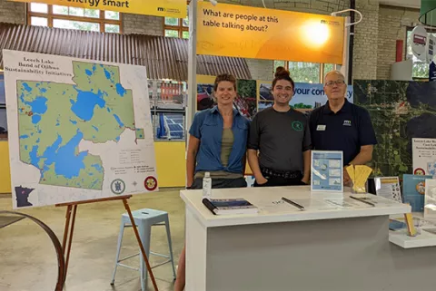 Brandy Toft, Eugene Strowbridge, and Peter Berger (MN Department of Commerce) sharing LLBO’s achievements at the 2022 State Fair EcoExperience.