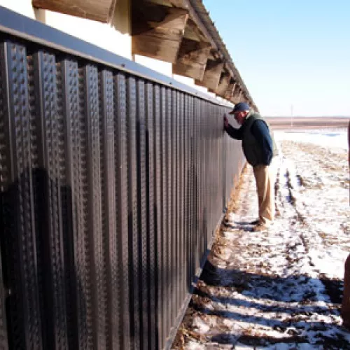 Attendee gets a close-up look at the barn's solar thermal air heat system