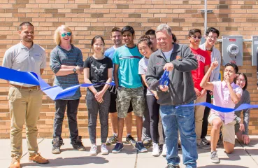 People at a ribbon-cutting ceremony