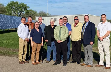 School board and reps with solar array