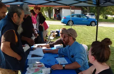 people at event table outside