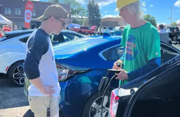 Kyle speaking with EV owner