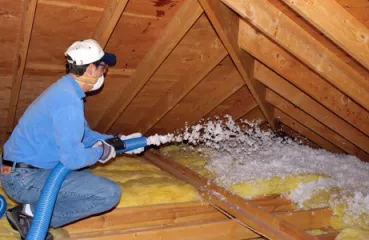 Blowing cellulose insulation into an attic after air sealing