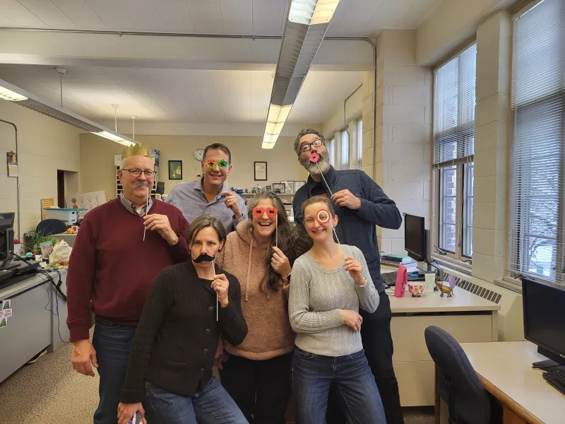 CERTs staff in the office with costume props