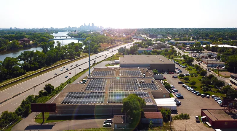 Solar on building with cityscape in background